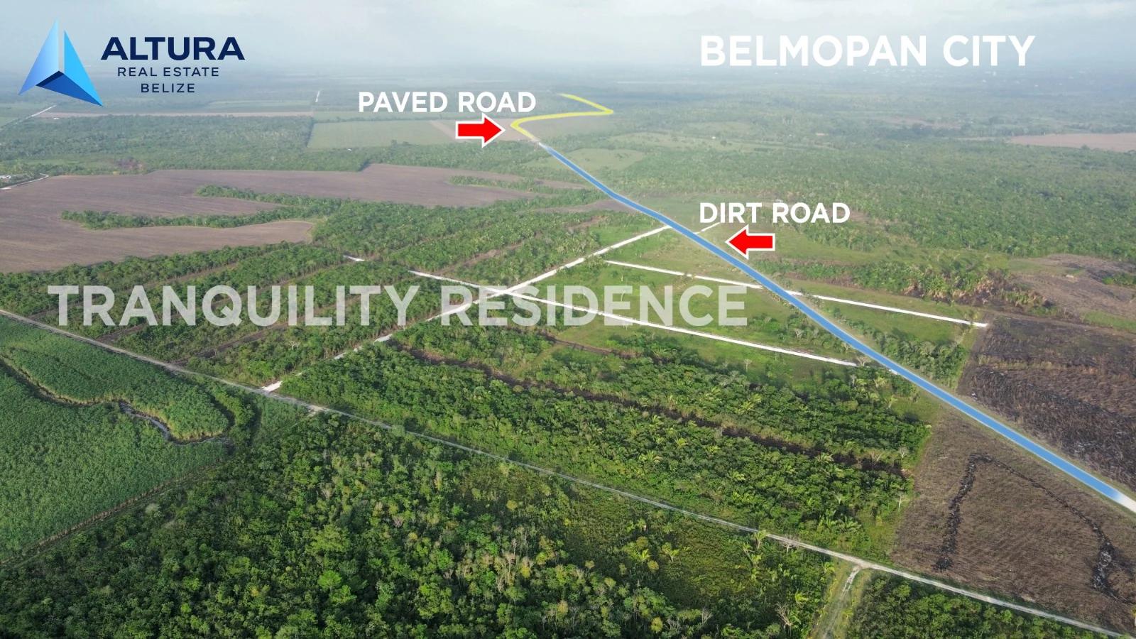 Aerial showing the paved road and dirt road approaches to the subdivision